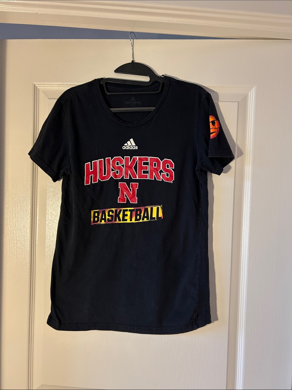 adidas Black Huskers Basketball Graphic Tee with Red and Yellow Accents